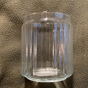 New Candle-lite ribbed glass candle holder.  Approximately 3 3/4” x 4 3/4”